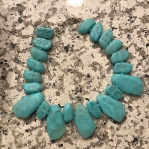 Flinstone looking teal rock like necklace
